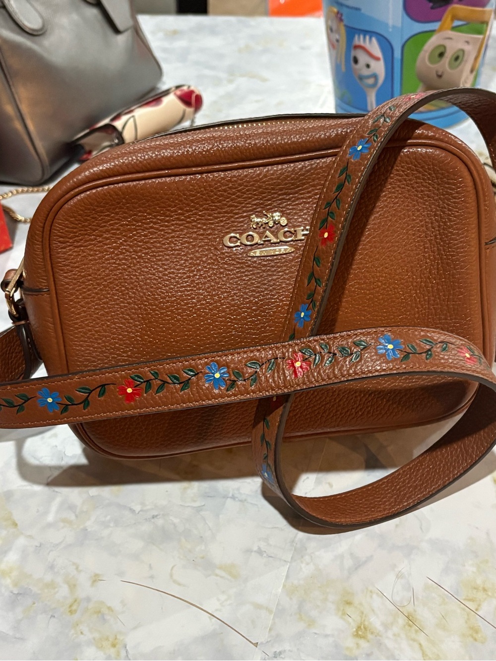 COACH Brown Pebbled Leather Crossbody with Floral Strap